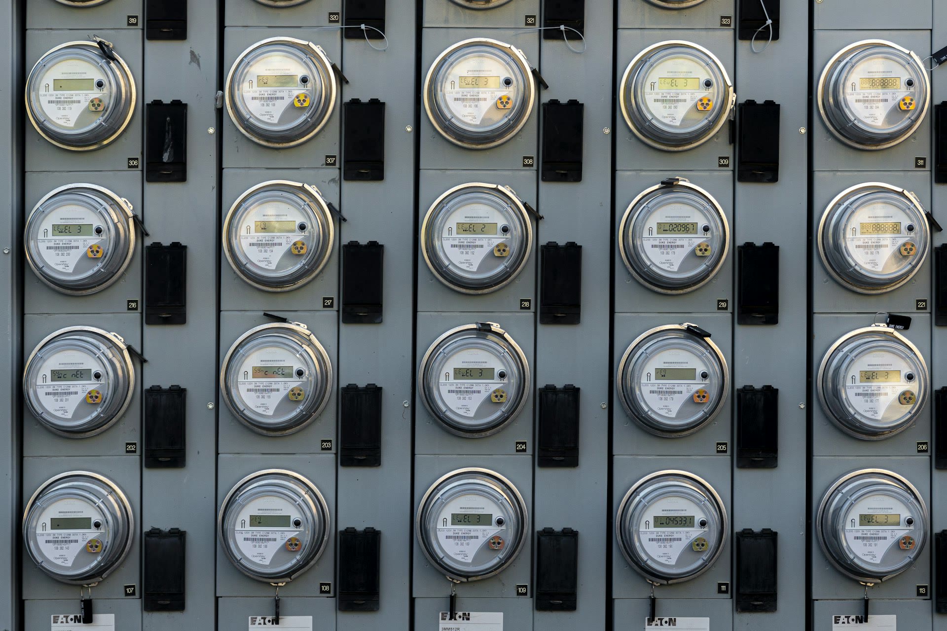 A bank of residential electricity meters, the kind that tracks a home server's power draw